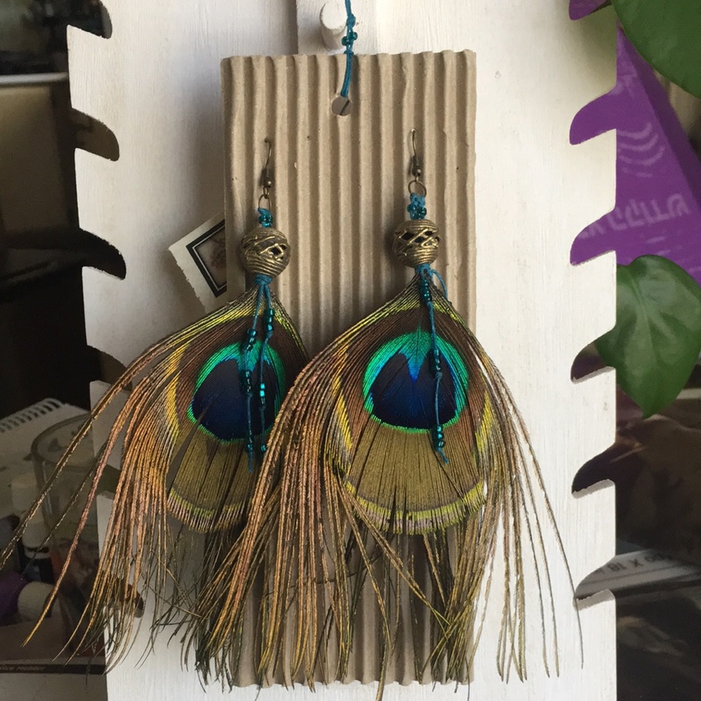 Unique brand new peacock 🦚 feather earrings- never worn. For pierced ears.